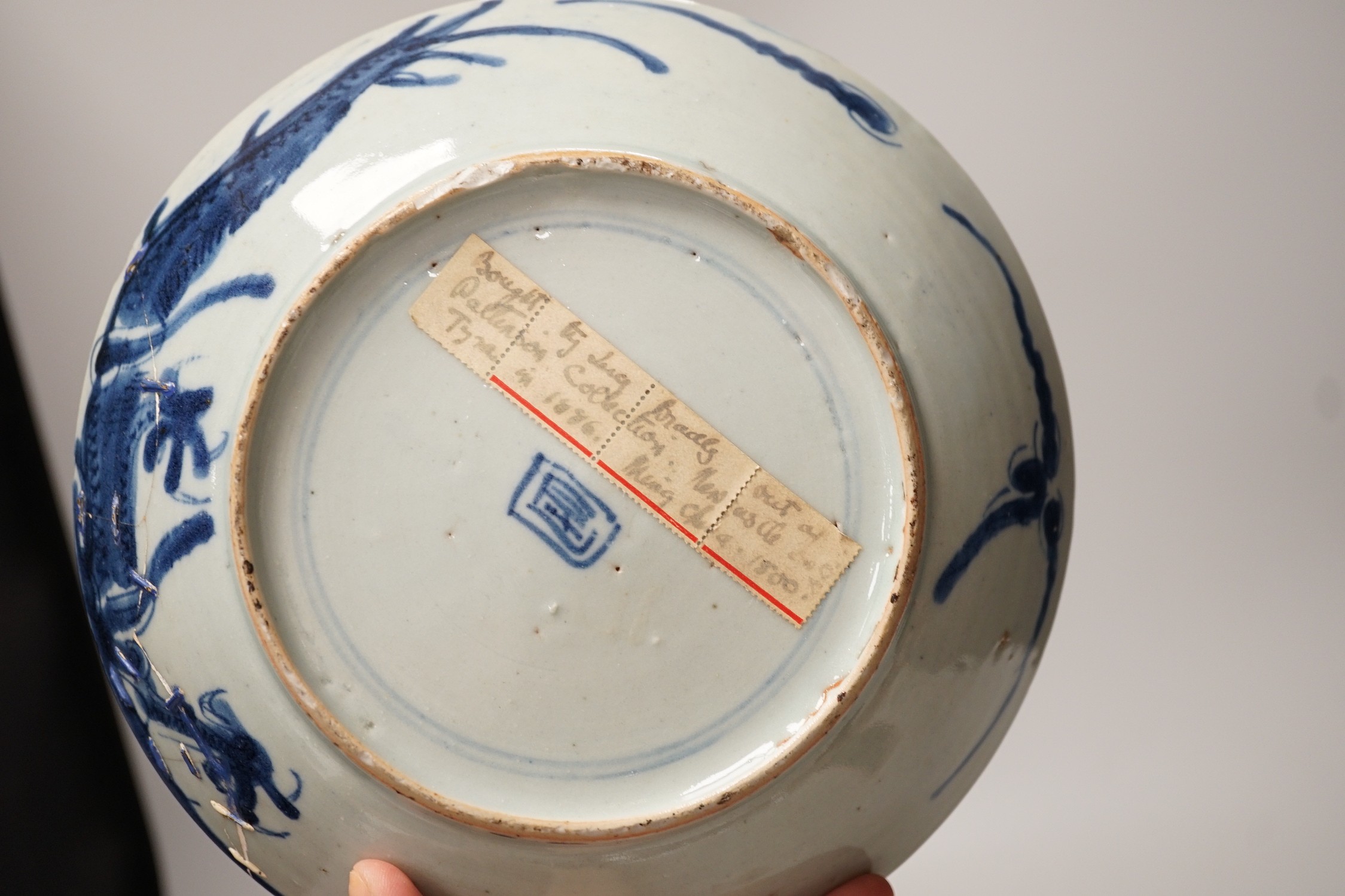 Two 19th century Chinese blue and white dishes and two 18th century tea bowls, largest 23cm diameter